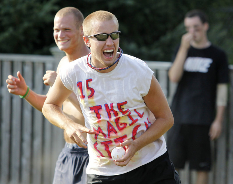 Chris Biskup, front, and Josh Mackie celebrate after their team, The Magic Sticks, forced a third game in the final series with a come-from-behind win.