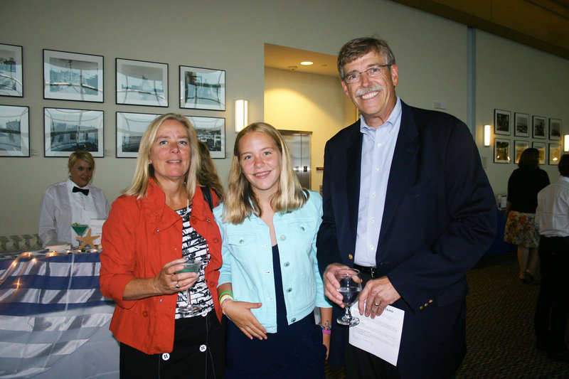 Ellie Baker, of Baker Newman Noyes, her daughter Hannah Saturley, and her husband, Tom Saturley, who was the nights auctioneer.