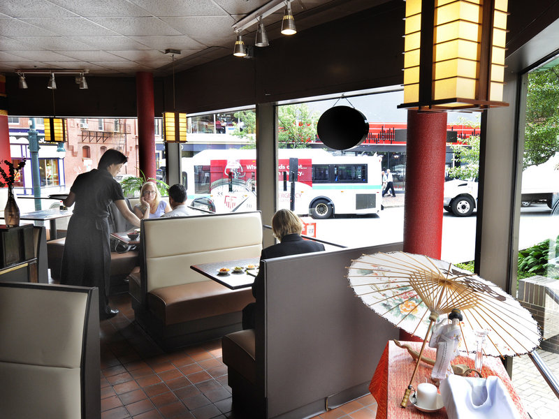 Server Catherine Burrill waits on a table at Soju, which serves inexpensive Korean and Japanese specialties.