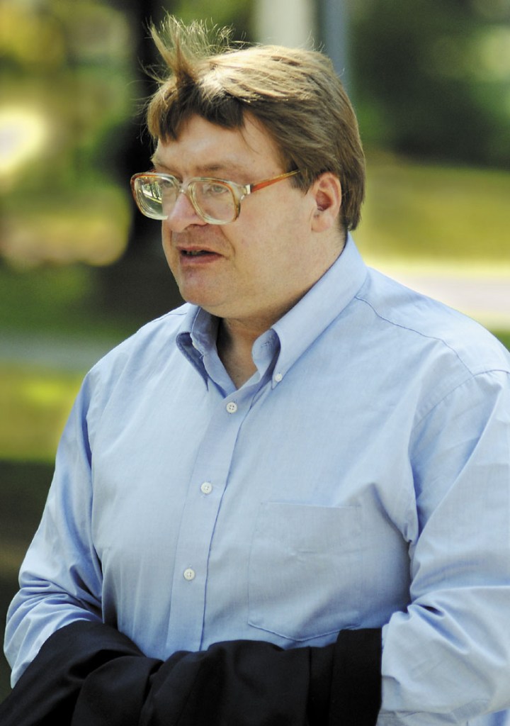 Staff photo by Andy Molloy DAY TWO: Kenneth McDonald walks from the Kennebec County Jail to the Kennebec Superior Court Tuesday during the second day of his murder trial.