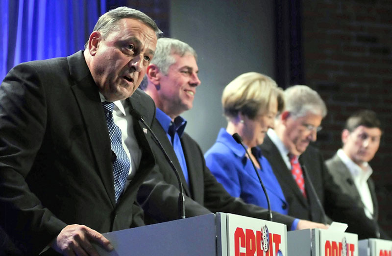 Staff photo by Joe Phelan Republican Paul LePage, left, answers a question as fellow candidates, independent Shawn Moody, Democrat Libby Mitchell, independent Eliot Cutler and independent Kevin Scott listen on Saturday night during first of the The Great Debates, sponsored by MaineToday Media Group, WGME TV-13 and WGAN radio, at the University of Maine at Augusta. mitchell lepage scott