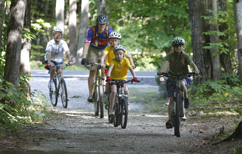 Brian Danz of the Greater Portland chapter of the New England Mountain Biking Association rides with beginning mountain bikers at Bradbury Mountain State Park in Pownal last Saturday.