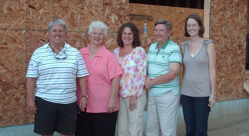 Open Hands - Open Heart founder/operator Elaine Fournier, left, poses with organization committee members, from left, Rita La Chance, Jodi-Marie McCarthy, JoAnn Klikier and Jackie Chaplin. The reuse center provides donated clothing for children ages 11 and younger, as well as toys and school supplies.