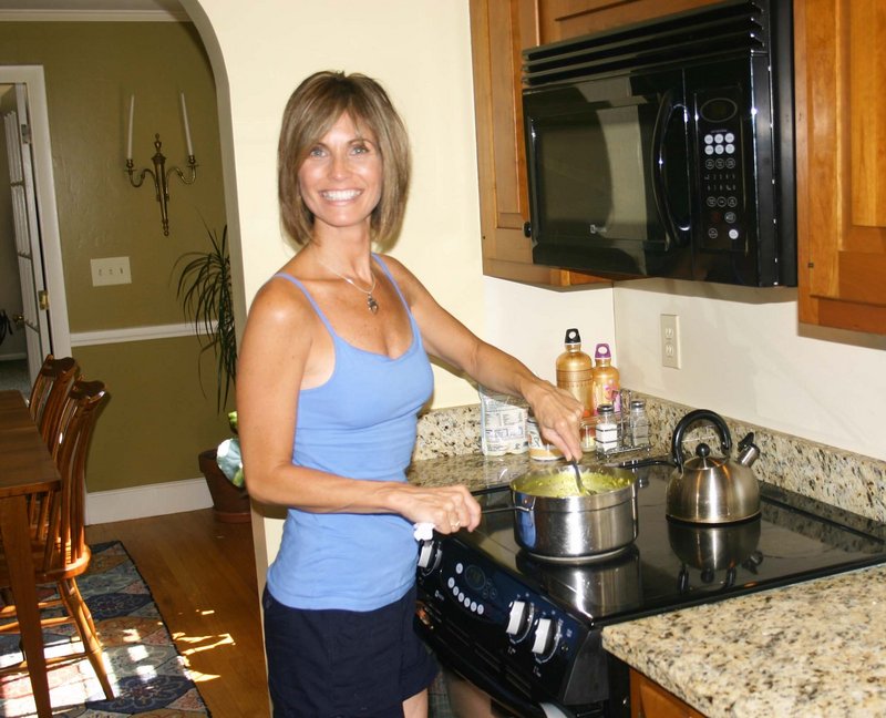 Certified ayurvedic consultant Sandra Maguire stirs a dish of kitcheri, made with mung dal, basmati rice, ghee, turmeric, cumin, coriander, ginger and mustard seed.