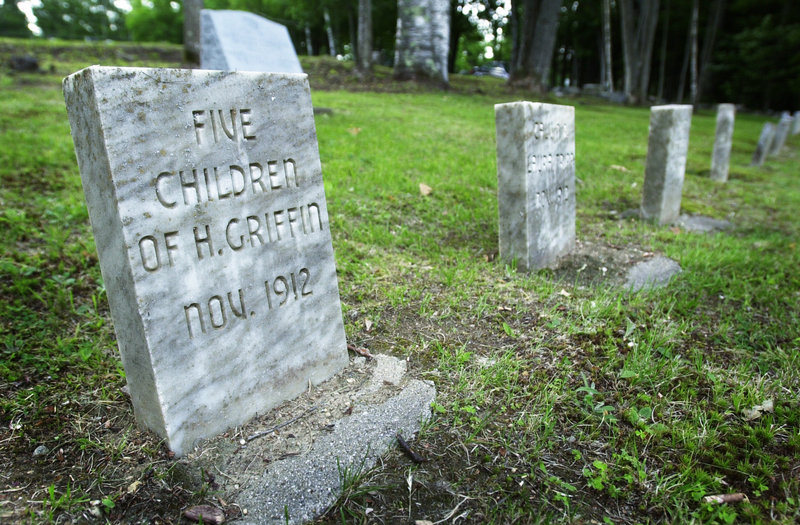 This stone marks a grave in the Pineland Farms cemetery with some of the bodies that were moved in 1912 from Malaga Island. State workers exhumed all 17 graves in Malaga’s cemetery and reburied the remains among nine plots in the graveyard of the facility in Pownal.