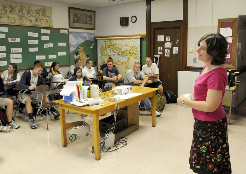 ABOVE: Portland High Latin teacher Michelle Tucci leads students in her Latin poetry class. The classical language program serves twice as many students as it did a decade ago. “When they’re with us, they’re in the Latin zone,” Tucci says. “We don’t go through the motions, ever.” BELOW: Latin teacher Phil Thibault, an accomplished singer and musician, teaches a class at Portland High. “We break into song for things that are really hard to memorize,” he says.