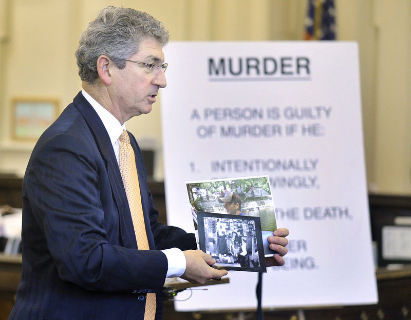 Prosecuting attorney William Stokes shows the jury video camera photos taken at a northern New Hampshire convenience store, allegedly of Jason Twardus, during the state's closing arguments Thursday.