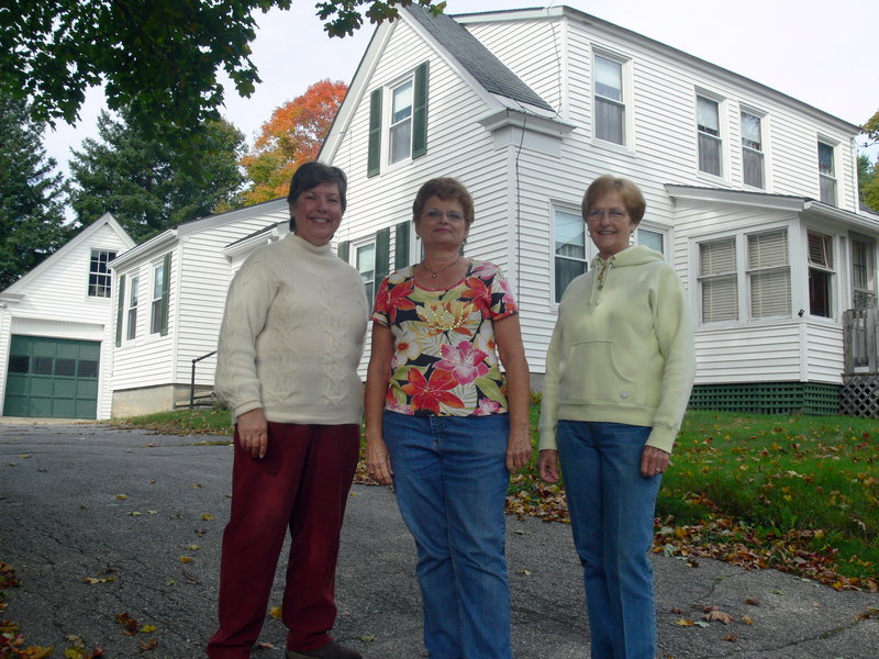 Windam Historical Society presidents, from left, Linda Hanscom, Isabelle Gilman and Norma Rogers stand at October House, located next to the society's current home.