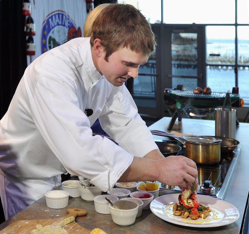 Kelly Patrick Farrin, chef at the Azure Cafe in Freeport, prepares his winning dish, Herb Grilled Maine Lobster Tail on Arugula, during Harvest on the Harbor on Friday.