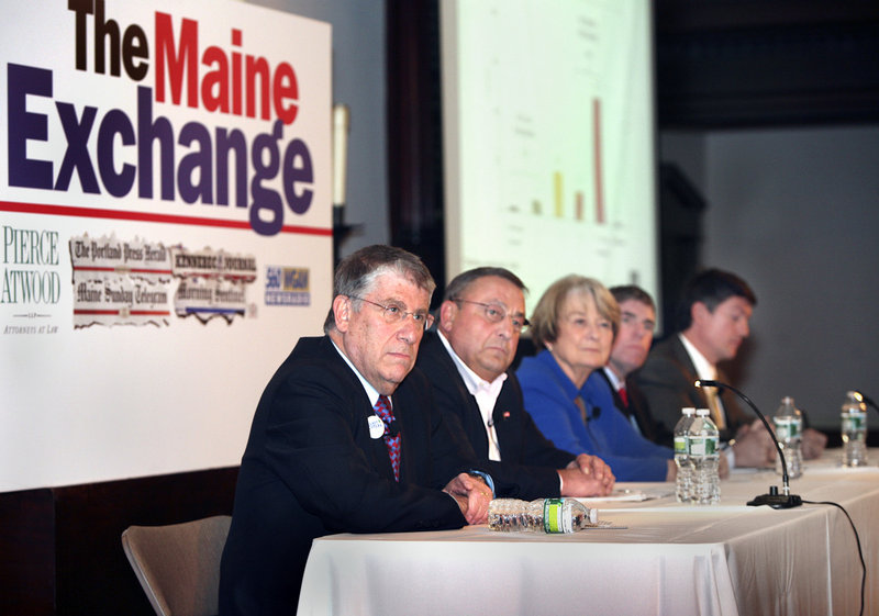 Maine’s gubernatorial candidates, from left, Eliot Cutler, Paul LePage, Libby Mitchell, Shawn Moody and Kevin Scott listen as a question is posed during The Maine Exchange at the First Parish Unitarian Church in Portland on Saturday.