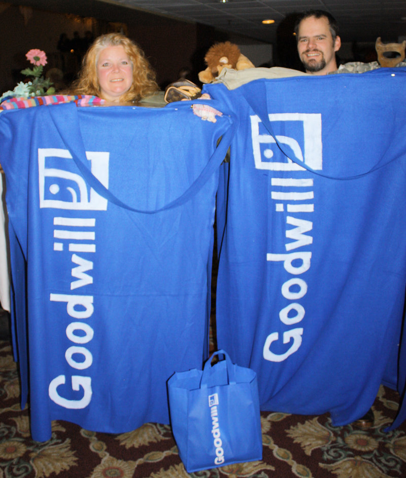 Jennifer Libby-Barnes and Robert Barnes, who won the Best Group Costume award dressed as Goodwill shopping totes.