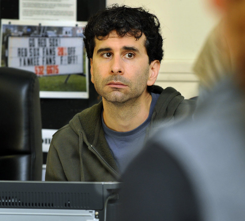 John Cariani listens to a reading of his new play, “Last Gas,” at Portland Stage Company. The playwright has rewritten parts of the play throughout three weeks of rehearsals, and last week, the actors tried several endings to see what worked best.