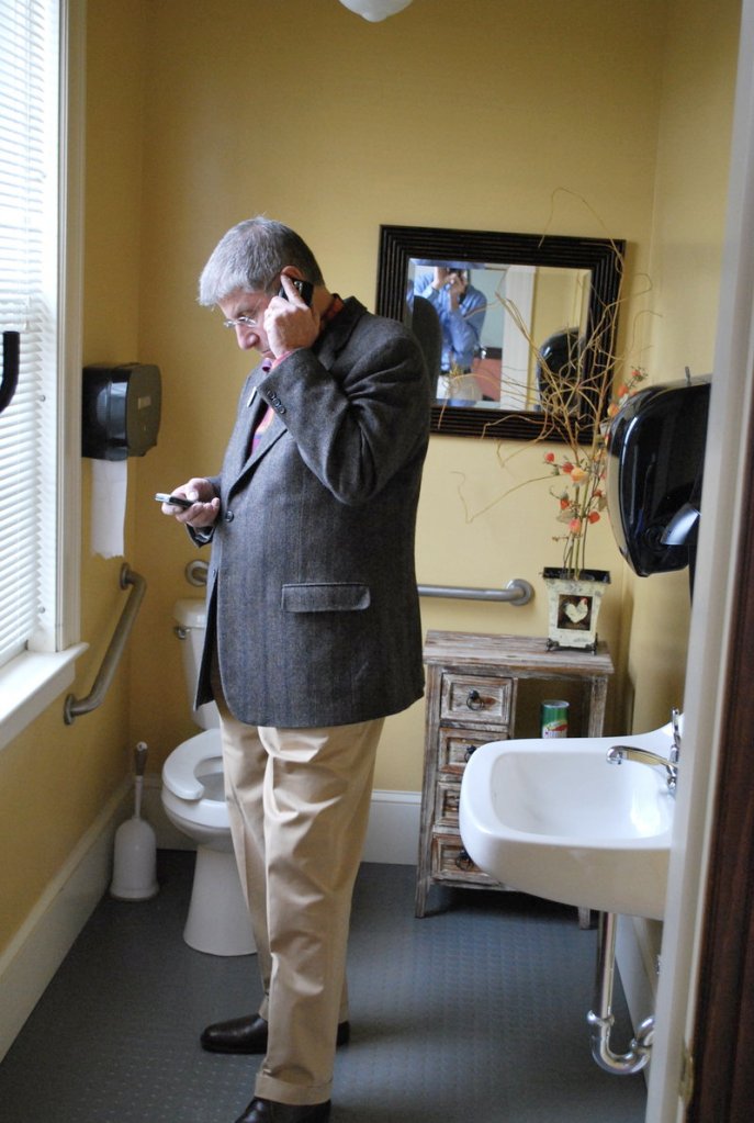 Eliot Cutler calls in to a Portland news conference where he was being endorsed by former Gov. Angus King, during a stop Saturday at the Maine Grind coffee shop in Ellsworth.