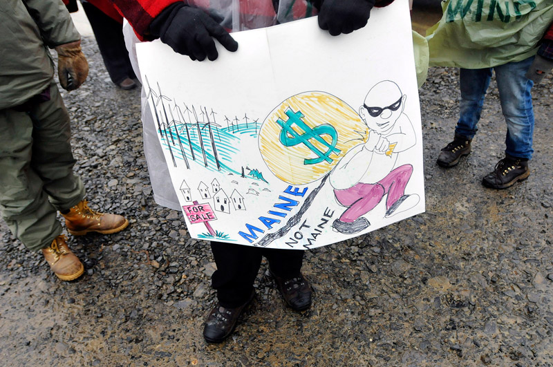 Staff Photo by Shawn Patrick Ouellette: One of the signs held by protesters outside the Rollins wind energy project in Lincoln Monday, Nov. 8, 2010.