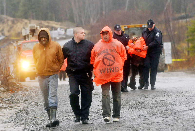 Staff Photo by Shawn Patrick Ouellette: Protesters are arrested after blocking construction vehicles at the Rollins wind energy project in Lincoln Monday, Nov. 8, 2010.