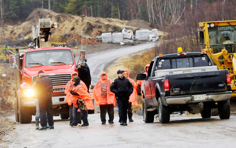 Staff Photo by Shawn Patrick Ouellette: Protesters are arrested after blocking construction vehicles at the Rollins wind energy project in Lincoln Monday, Nov. 8, 2010.