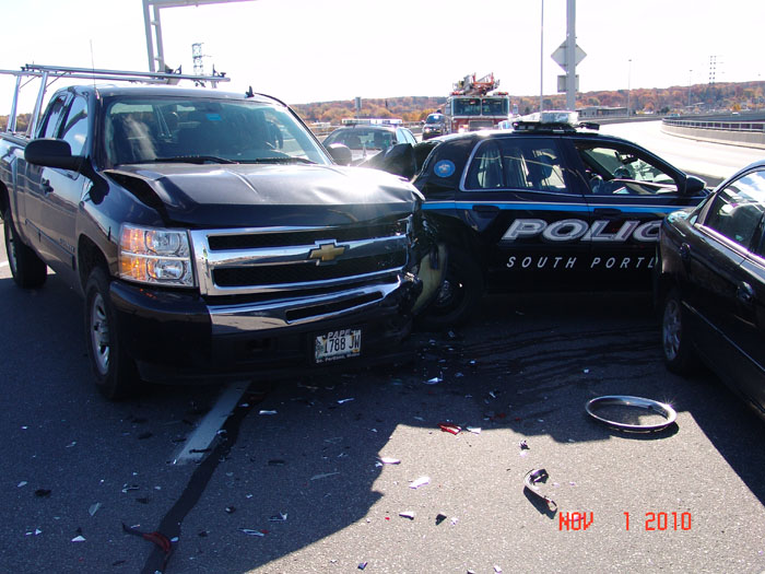 A pickup truck driven by David Zografos of South Portland slammed into the cruiser and drove it into the median, says Police Chief Ed Googins.