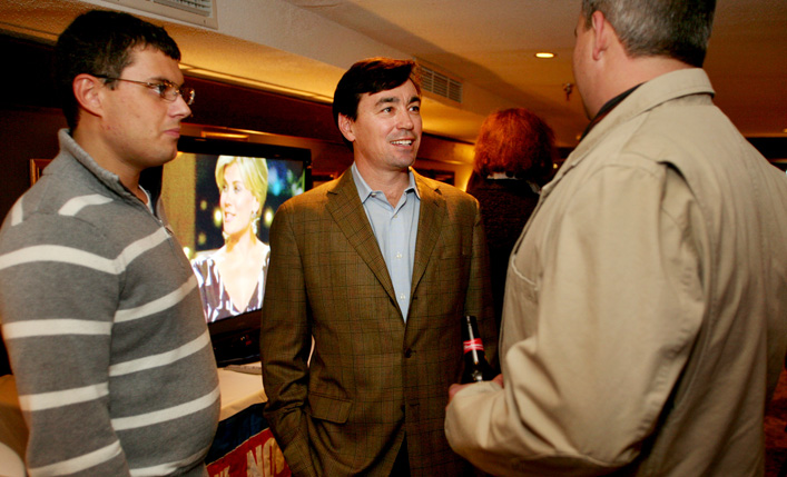 Rob Lally, middle, treasurer of Black Bear Entertainment, visits with Zac Creps of Oxford, left, and Mark Ferguson of Poland Springs, during the Yes on 1 Four Season Resort and Casino reception at DiMillos Floating Restaurant.