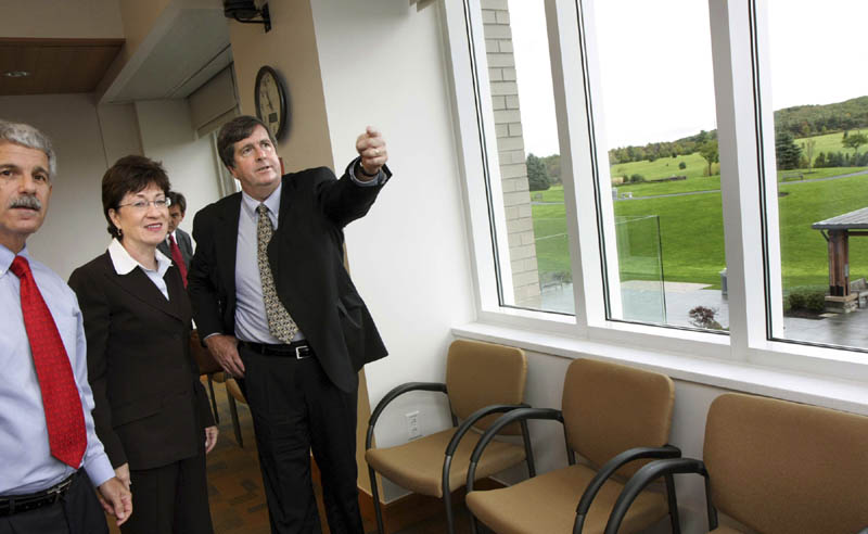 MaineGeneral Health President Scott Bullock, right, orients Sen. Susan Collins, R-Maine, and Augusta Mayor Roger Katz as to the location of the proposed construction of the full interchange for exit 113 during a meeting about the hospital's plans for a new regional hospital in Augusta on last month. The meeting took place inside the Harold Alfond Center for Cancer Care.