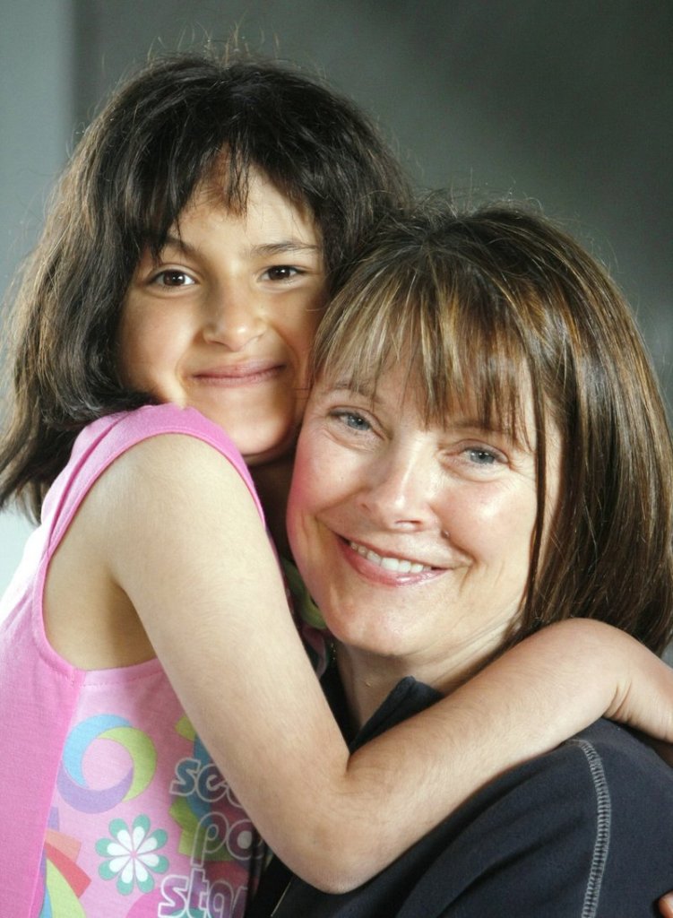 Noora Afif Abdulhameed and Susi Eggenberger pose for a photo during a going away party for the girl in 2009.