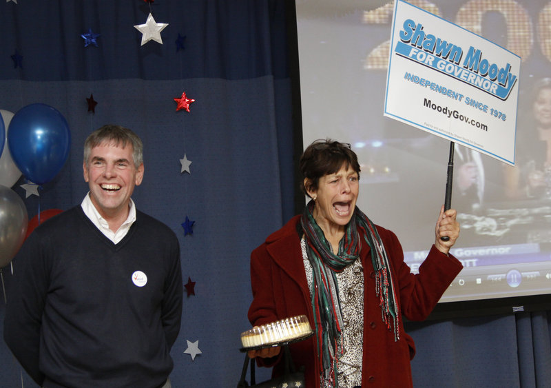 Shawn Moody, an independent candidate for governor, shares a light moment with his sister Kim Moody during an Election Day gathering Tuesday night at the Moody’s Collision Center in Gorham. Moody would not commit on his future political plans.