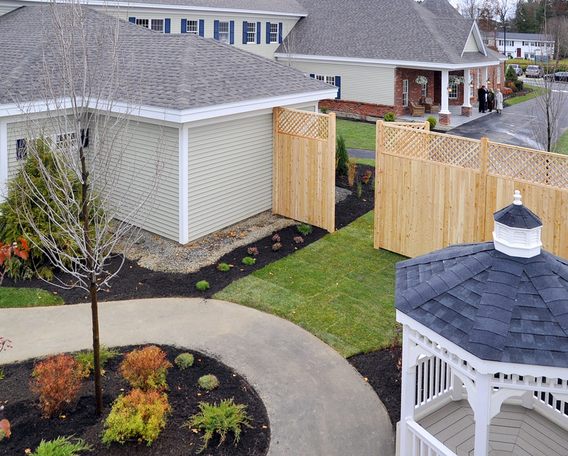 The courtyard at Woodlands Assisted Living is viewed from above as people arrive for the grand opening.