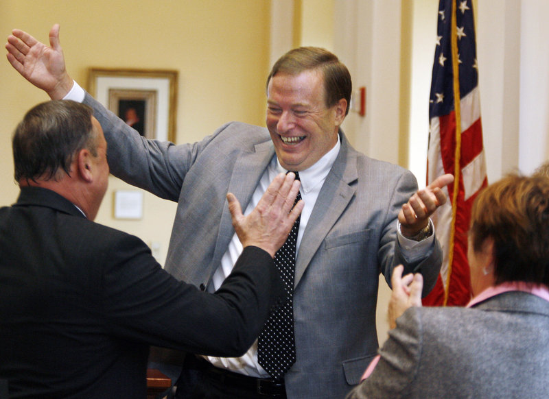 Maine Senate President Kevin Raye, center, a Republican from Perry, welcomes Gov.-elect Paul LePage to the Senate chamber Friday at the State House in Augusta.