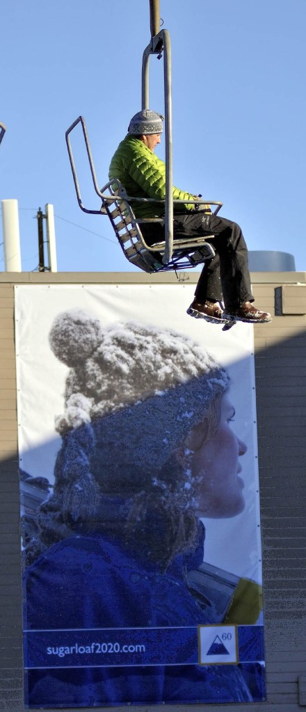 A skier rides on a chairlift Tuesday afternoon at Sugarloaf. A lift derailed in high winds at Maineâs tallest ski mountain Tuesday, sending skiers plummeting as far as 30 feet to the slope below and injuring several people.