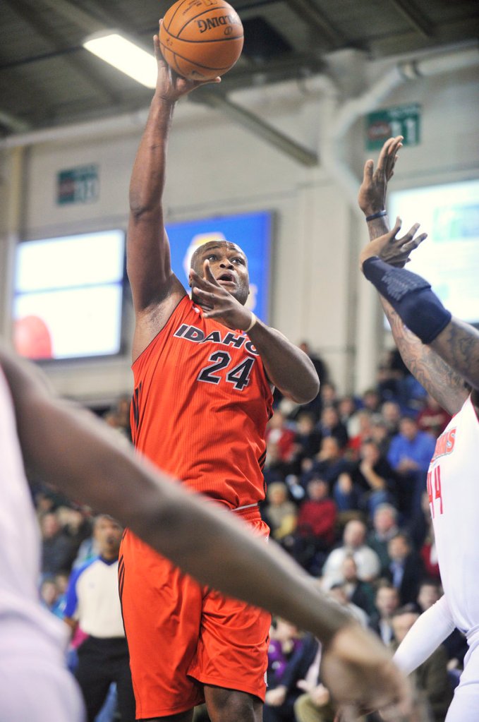 Antoine Walker, the former Boston Celtics standout who is attempting to return to the NBA, lifts a shot in the lane Thursday night for the Idaho Stampede. Walker scored 25 points, but the Maine Red Claws came away with a 105-99 victory at the Portland Expo.