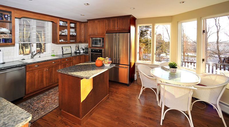 The updated kitchen boasts an eating area with views outside.