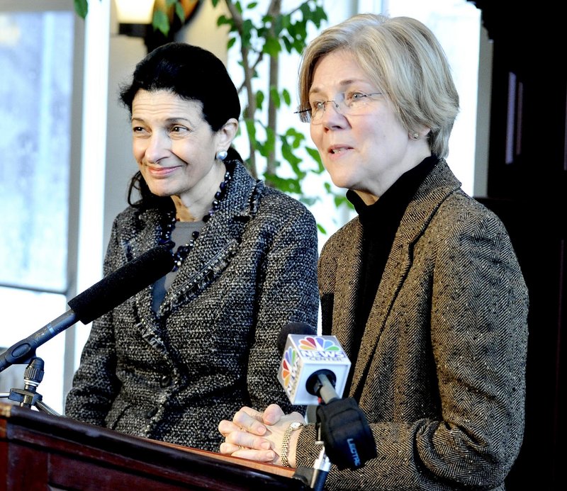 Sen. Olympia Snowe and Harvard professor Elizabeth Warren, right, talk with the media Wednesday in Portland. Snowe had invited Warren to meet with Maine businesspeople.