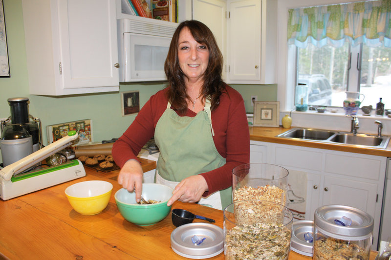 Betty Crush creates her raw, vegan energy bars in her Freeport kitchen. Mom's products are free of gluten and refined sugars.