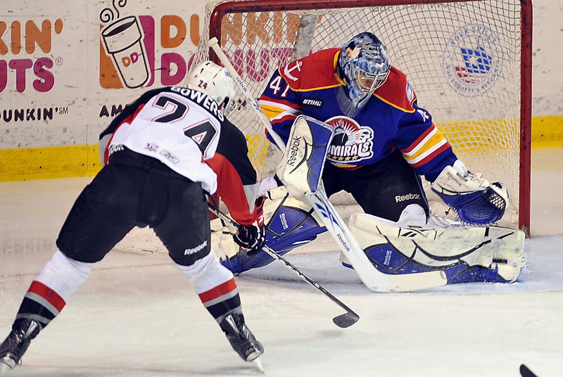 Justin Bowers of the Pirates has his shot blocked by Norfolk goalie Mike Smith Tuesday night, but Portland went on to earn a fourth straight victory.