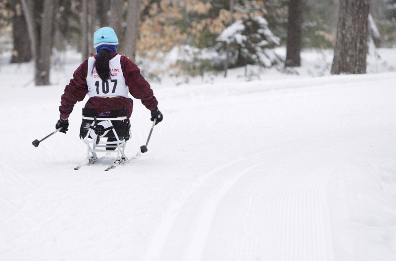 Christina Kouros pushes her way down a trail at Pineland Farms. Kouros is at the forefront of a movement to include more physically challenged students in mainstream sports.