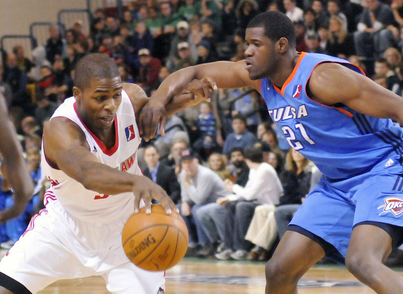 Maine's DeShawn Sims, fighting off Tulsa's Latavious Williams, led the Red Claws with 26 points, including two with 13 seconds left that gave Maine the lead for good.