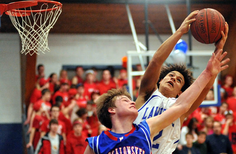 CRASH THE BOARDS: Lawrence’s Shaun Carroll, right, fights for the rebound with Messalonskee’s Gage Landry in the second quarter of their game Thursday night at Lawrence High School in Fairfield.