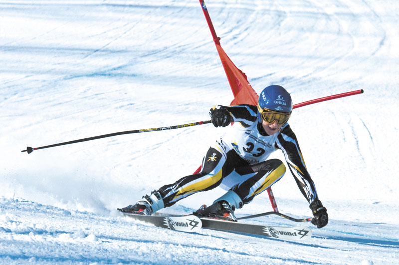 ON THE EDGE: Maranacook freshman Alec Daigle skies to a second place finish in the giant slalom at the Class B state ski championships Tuesday at Mt. Abram in Greenwood.