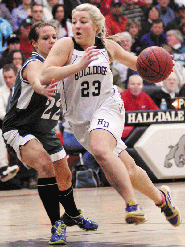 GOING STRONG: Hall-Dale’s Carylanne Wolfington, right, drives to basket past WInthrop’s Sasha Flaherty during their Mountain Valley Conference game Thursday night in Farmingdale. Wolfington scored a game-high 17 points as Hall-Dale won 58-32.