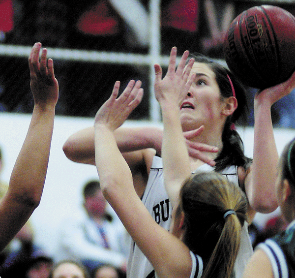 HANDS UP: Hall-Dale’s Taylor Massey goes up for a shot against several Winthrop defenders during their Mountain Valley Conference game Thursday night in Farmingdale.