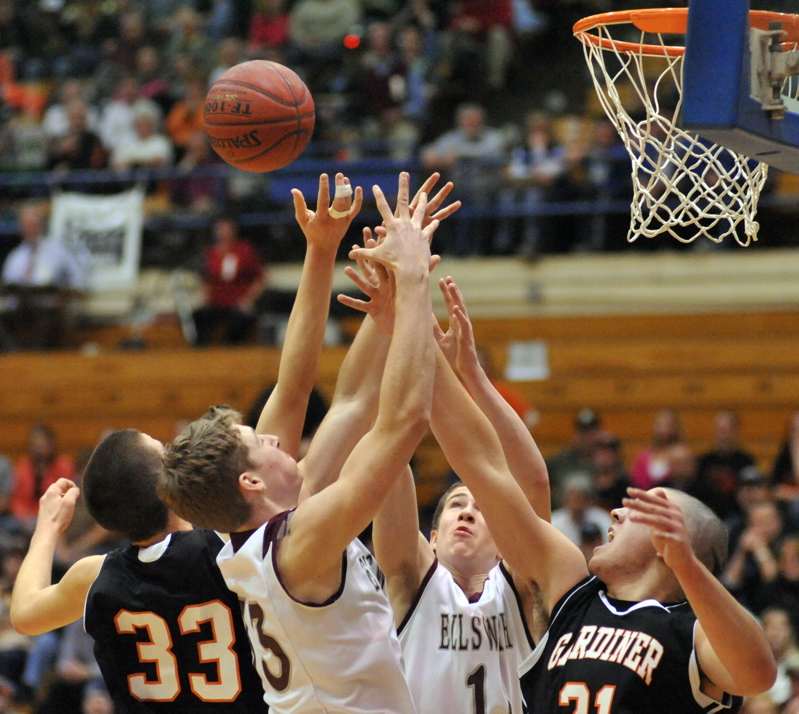 Gardiner's Aaron Toman, left, battles with Matt Blethen, second from left, during Ellsworth's 43-36 win in an Eastern Class B semifinal Wednesday at the Bangor Auditorium. Ellsworth advanced with a 43-36 victory.