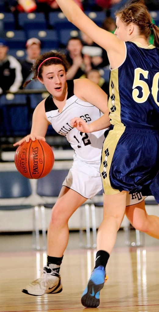 Hall-Dale junior guard Wendy Goldman, left, tries to go around Traip junior center Eileen Macomber during the Class C girls Eastern Maine semi-finals on Thursday afternoon at the Augusta Civic Center.