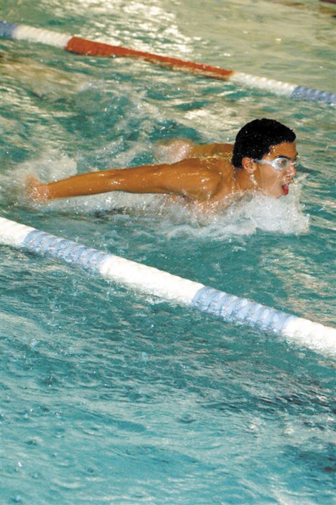 FITTING IN: Mody Gad, a foreign exhange student from Egypt, is swimming for the Waterville Senior High School boys team this winter. He is the No. 1 seed in both the 100- and 200-yard freestyle in the Class B state championship meet, which takes place Monday.