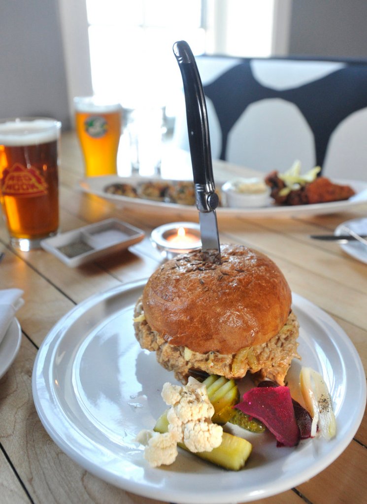 East Ender Chef/Co-Owner Mitchell Gerow's pulled pork sandwich with assorted pickles.