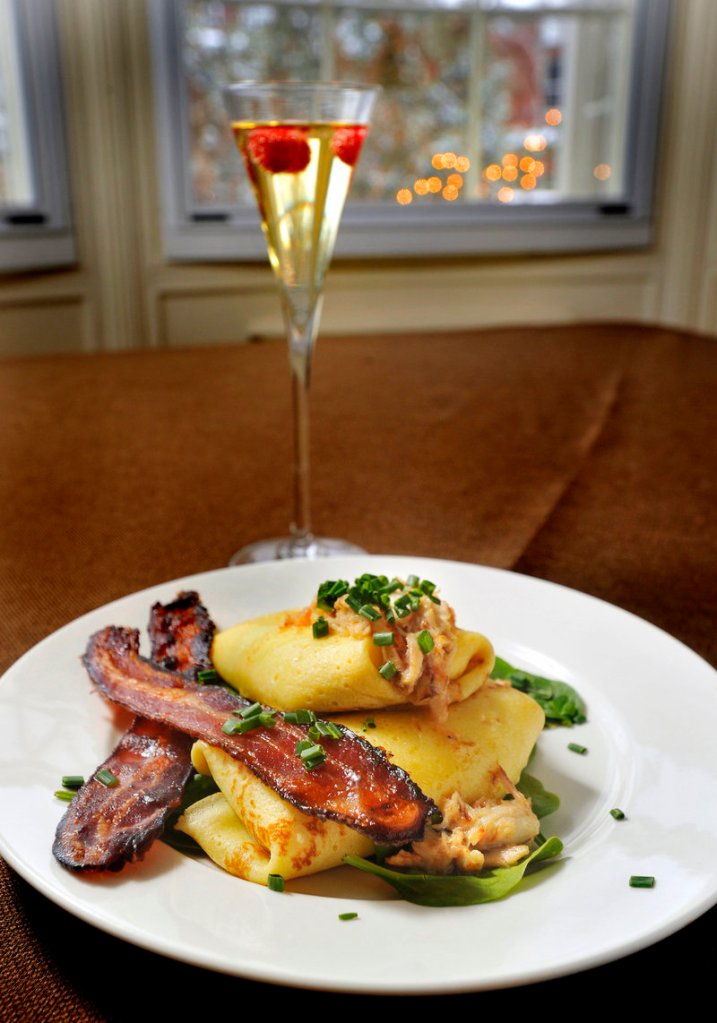 Ricotta, Parmesan and Asparagus Crepes topped with Maine Crab and Sherry Butter. The recipe is included in Dana Moos' new cookbook, "The Art of Breakfast: How to Bring B&B Entertaining Home," due out in June.