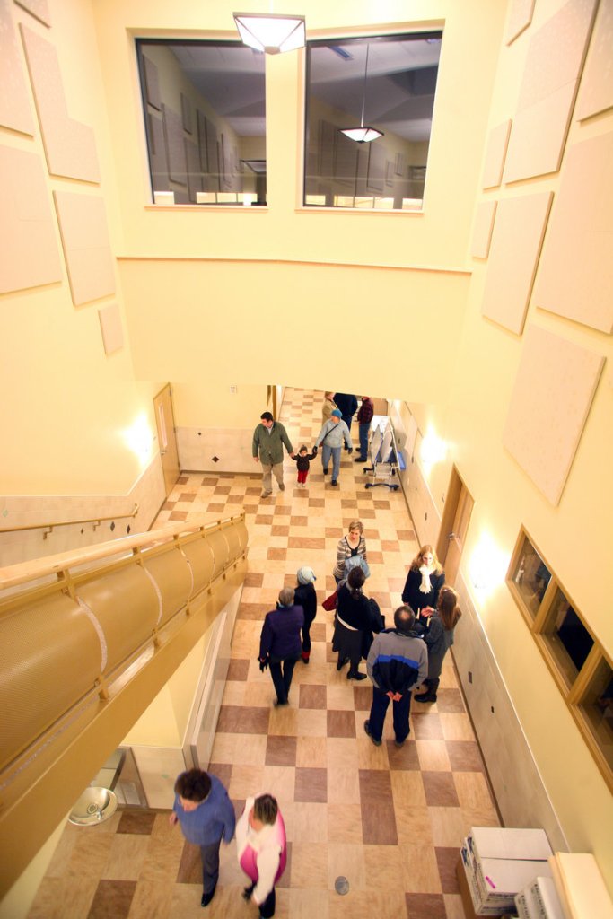 Visitors walk to the library and classrooms during an open house Wednesday for the new Ocean Avenue Elementary School in Portland.