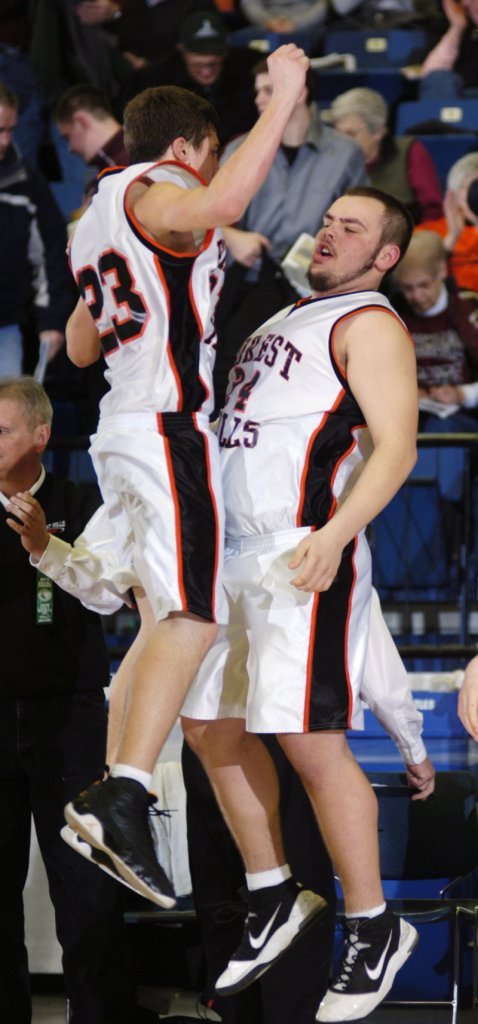 Evan Worster, left, chest-bumps with Joey Gilbert after scoring the basket Saturday that lifted Forest Hills over Rangeley.