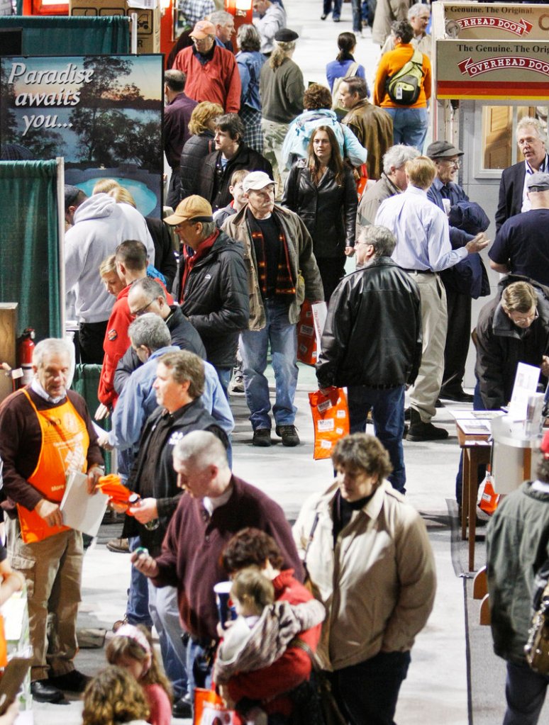 Home show-goers stroll from booth to booth at the civic center on Sunday. Some came to discuss projects, some to sniff out deals, some just to catch up on the latest cool stuff.