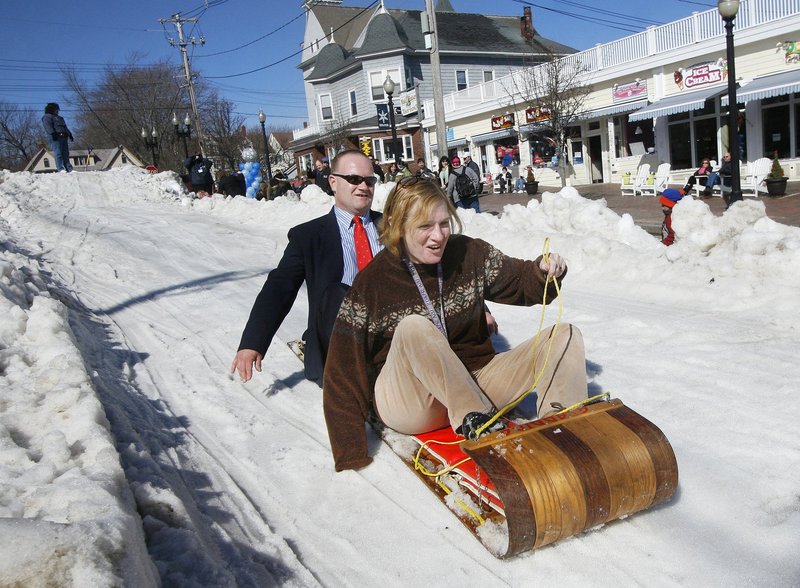 ... sledding on a street-turned-sliding hill ...