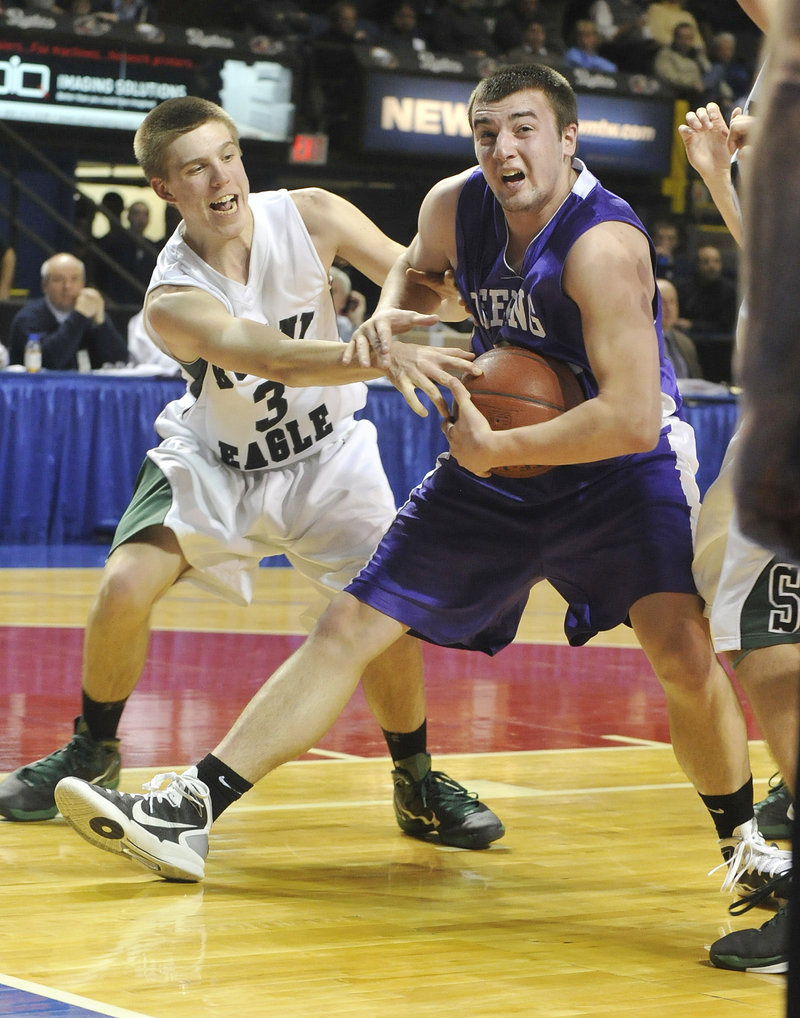 Jamie Ross of Deering keeps the ball from Steve Simonds of Bonny Eagle after pulling down a rebound Wednesday. Bonny Eagle won, 43-34.