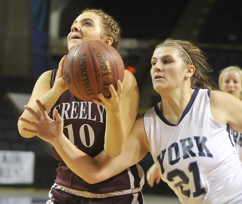 Chelsea Bridges of Greely is fouled by Lindsey Contella of York while attempting to shoot Thursday during their Western Class B semifinal at the Cumberland County Civic Center. York advanced with a 46-15 victory.
